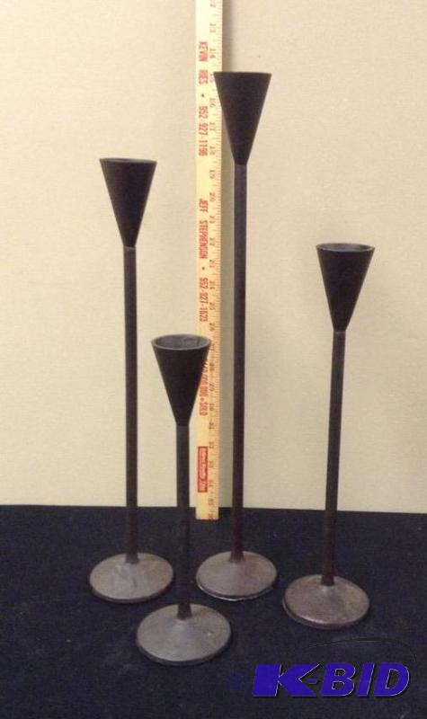 lot 7 image: Set of Four Iron Candle Stick Holders