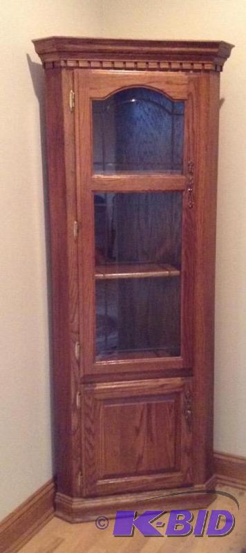 lot 17 image: Glass Front Oak Corner Cabinet