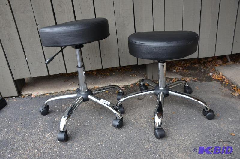 lot 10 image: two stools on wheels adjustable height 18-26...