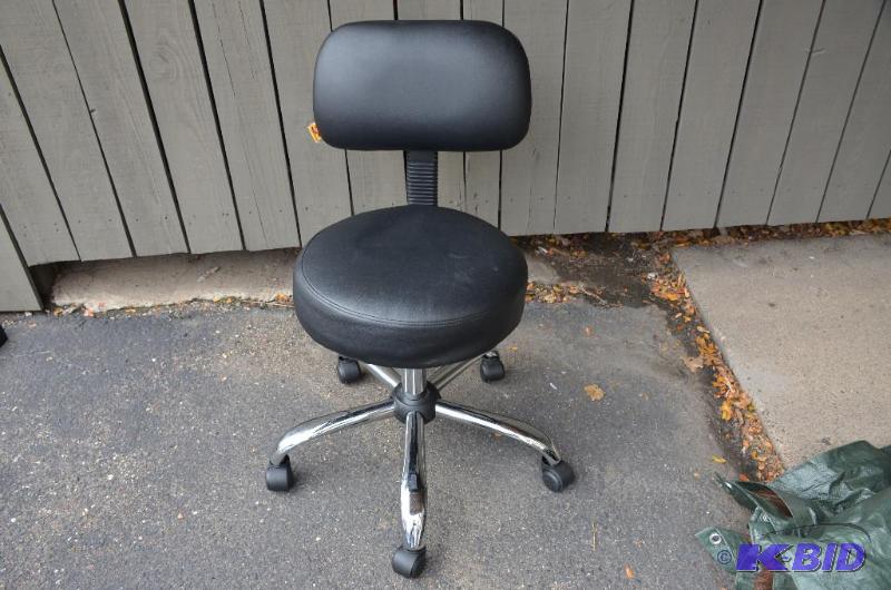 lot 15 image: 1 chair with back on wheels and adjustable he...