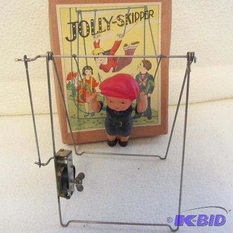 lot 104 image: Skipper Windup & Celluloid Doll
