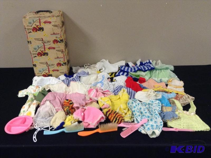 lot 99 image: Array Doll Clothes and Doll Suitcase