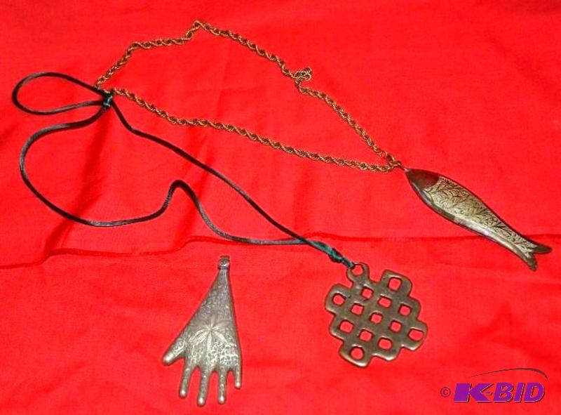 lot 69 image: Three necklaces, possibly silver...