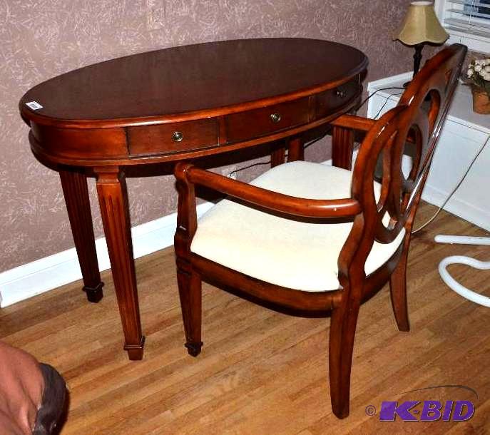 lot 11 image: Oval wood desk  table with drawer 26X43&...