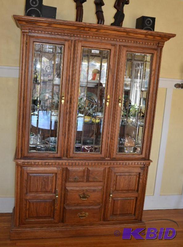 lot 33 image: lighted china hutch with lots of storage unde...