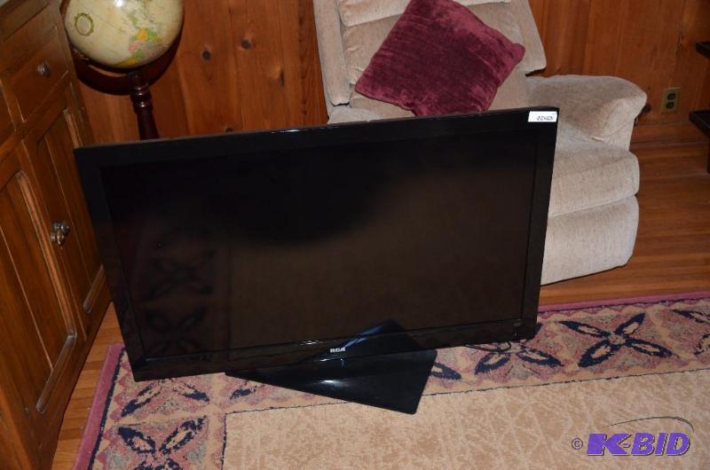 lot 61 image: Rca 46 LCD HDTV Flat screen with stand and re...