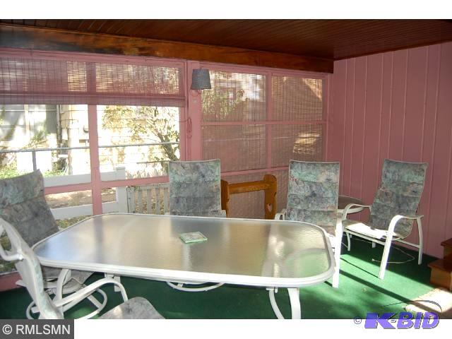 lot 85 image: Patio table with 4 chairs- always kept on 3 s...