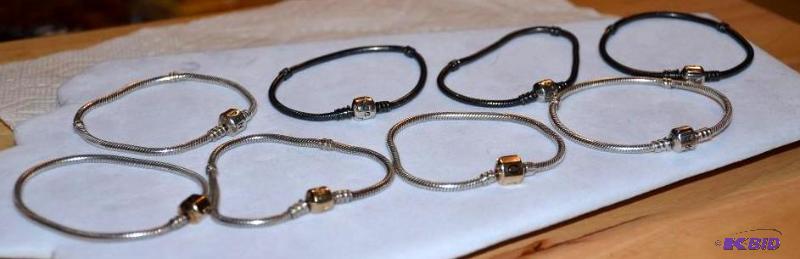 lot 23 image: 8 PANDORA 14k Gold and Sterling silver charm ...