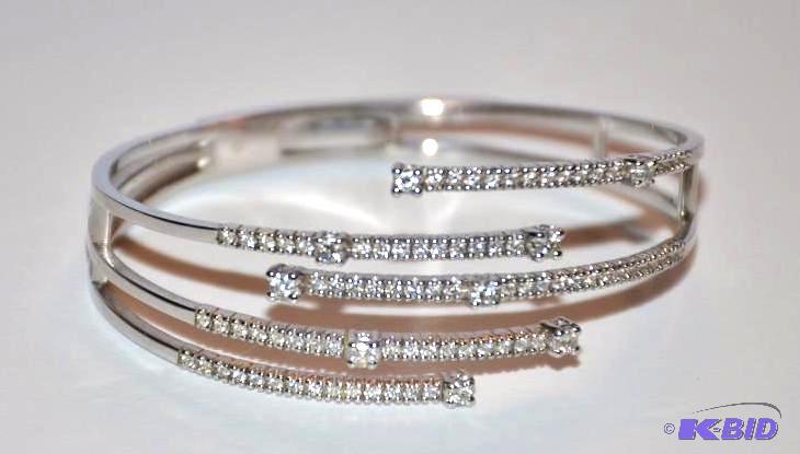 lot 5 image: Damiani   18k White Gold Diamond Cuff b...