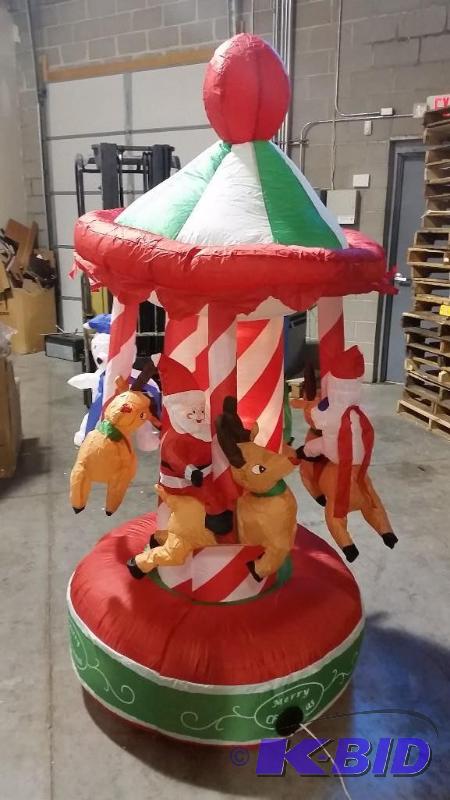 lot 51 image: Inflatable Christmas Merry Go Round  - Everyo...