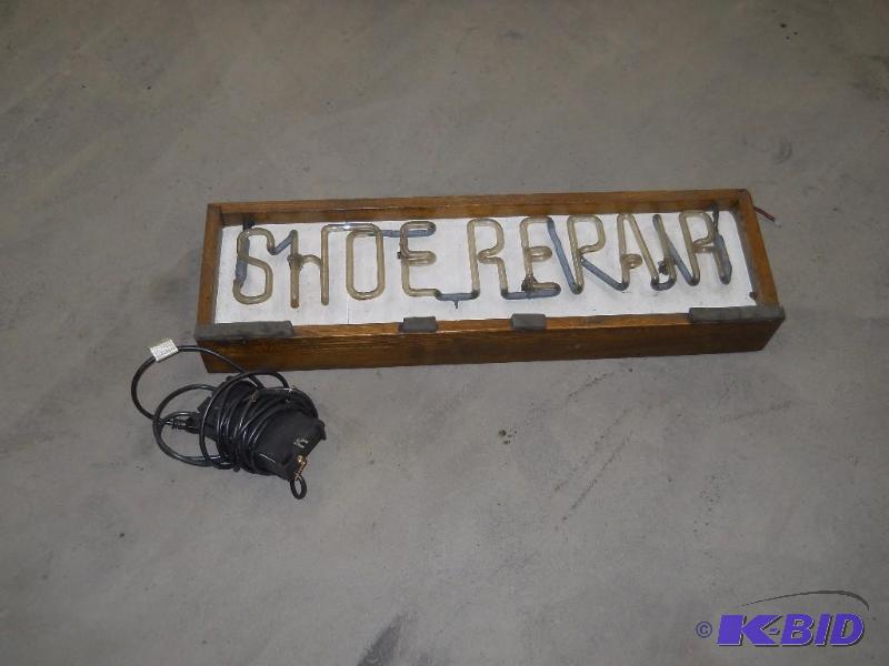 lot 105 image: Neon Shoe Repair Sign. 32.