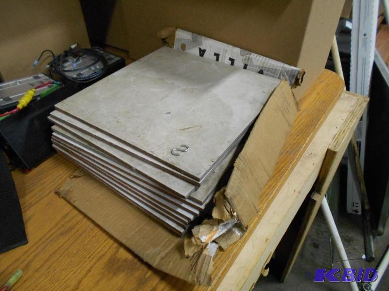 lot 56 image: Stack of Unused Tile.