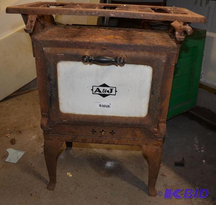 lot 15 image: Antique A&ampJ oven One rear leg is wobbly ...