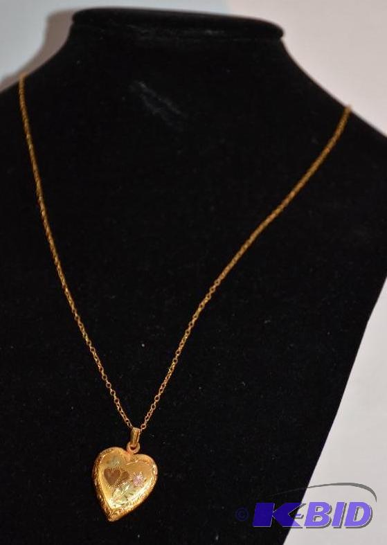 lot 181 image: 12k gold filled heart shaped locket that open...
