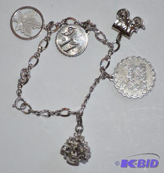 lot 182 image: Sterling silver charm bracelet...