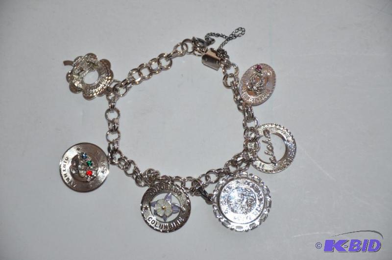lot 185 image: Creaster Sterling silver charm bracelet...