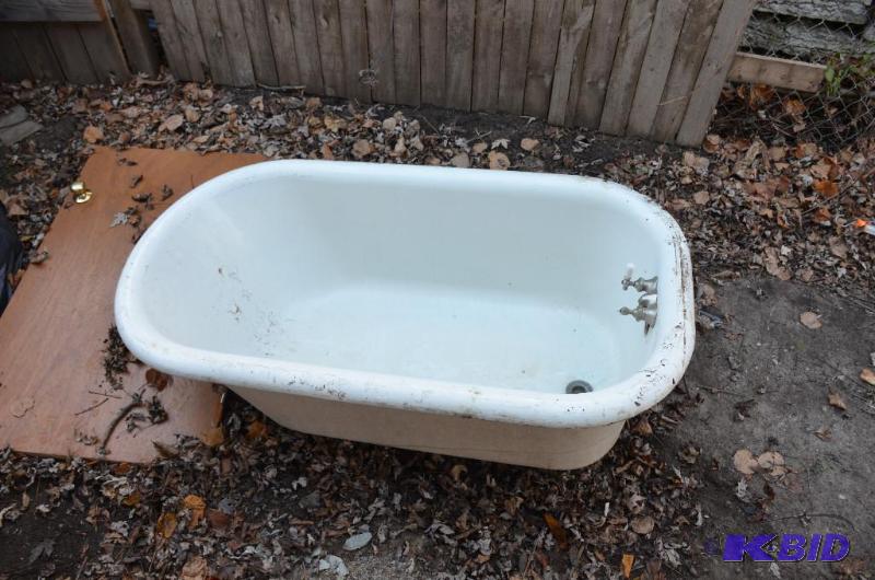 lot 48 image: Antique claw-foot bathtub- feet not there S.S...
