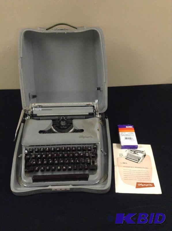 lot 32 image: Portable Olympia De Luxe Manual Typewriter with Case