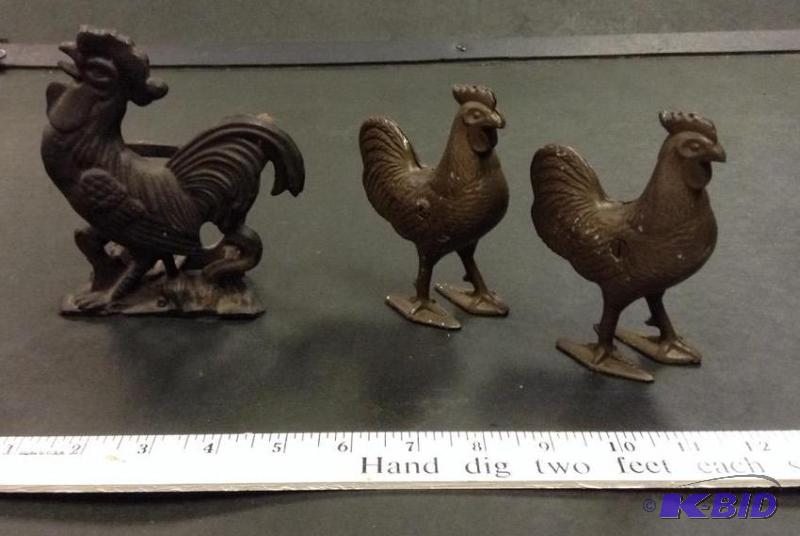 lot 28 image: Two Rooster Still Banks and a Rooster Napkin Holder