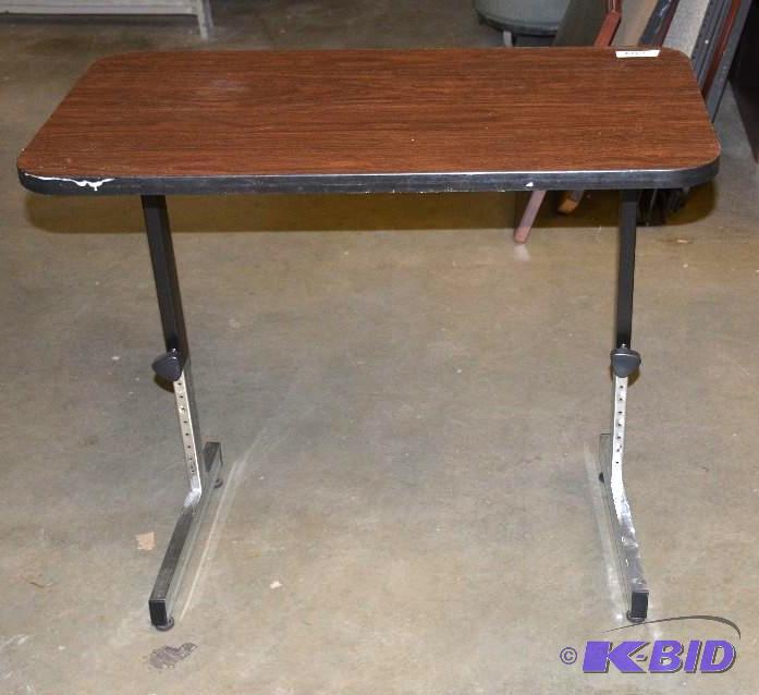 lot 123 image: Table with adjustable legs to adjust the heig...