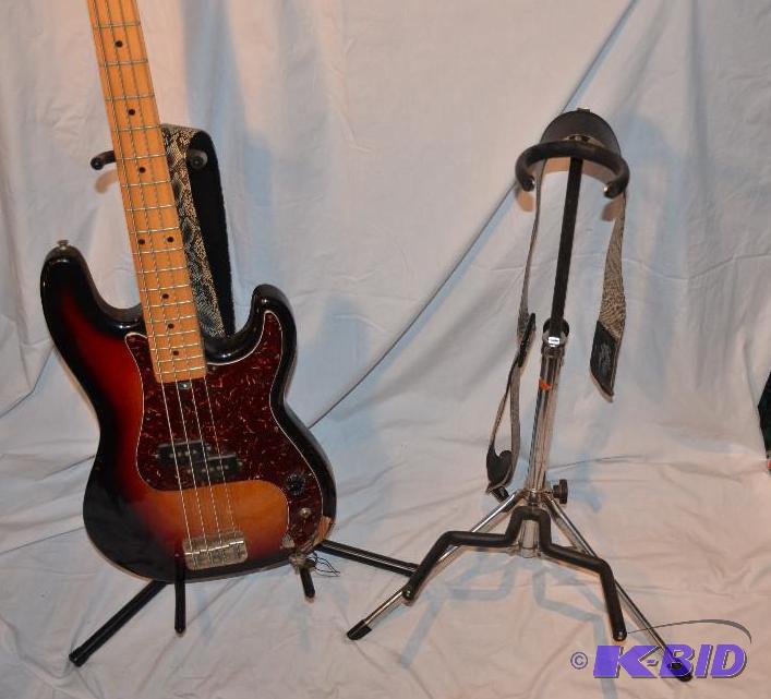 lot 156 image: 2 guitar stands & 2 guitar straps. Prolin...