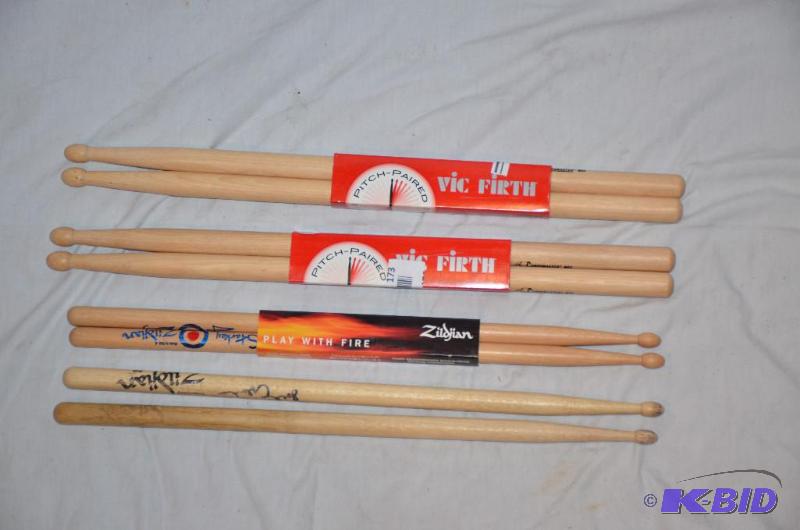lot 173 image: 3 sets of new drum sticks, 1 used set is auto...