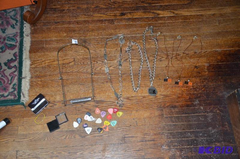 lot 187 image: No hand Hohnor harmonica, Ringo Star necklace...