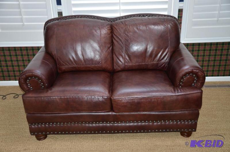 lot 105 image: Lazzaro Leather couch 64" long...