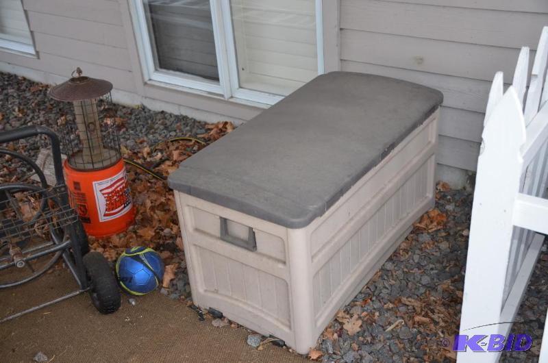 lot 246 image: Suncast deck storage box 48x24x24"...
