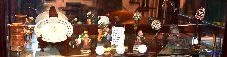 lot 28 image: Shelf of golf items...