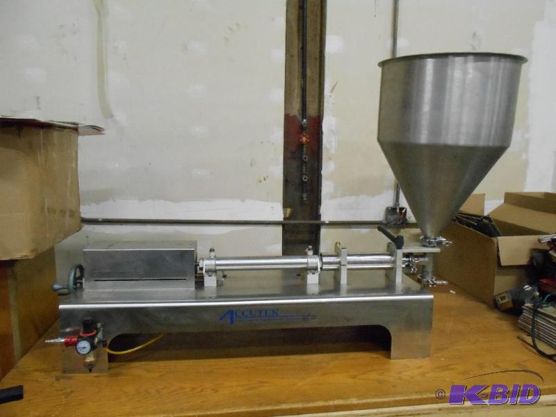 lot 1 image: Accutek SVF 1-16 Pneumatic Piston Filler. 1-16 Ounces. Air Powered.