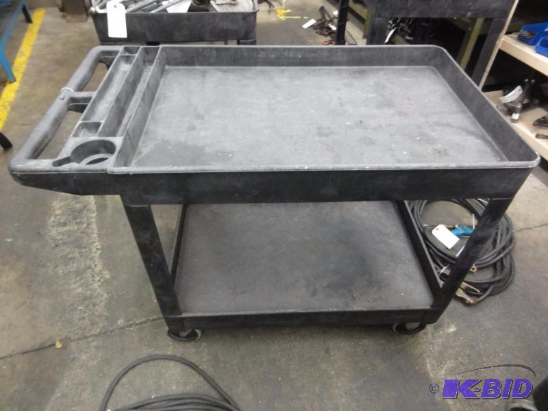 lot 1214 image: Rubbermaid Commercial Nylon Cart with shelf a...