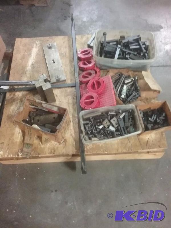 lot 511 image: Pallet of hold down clamps, shim stock rolls...
