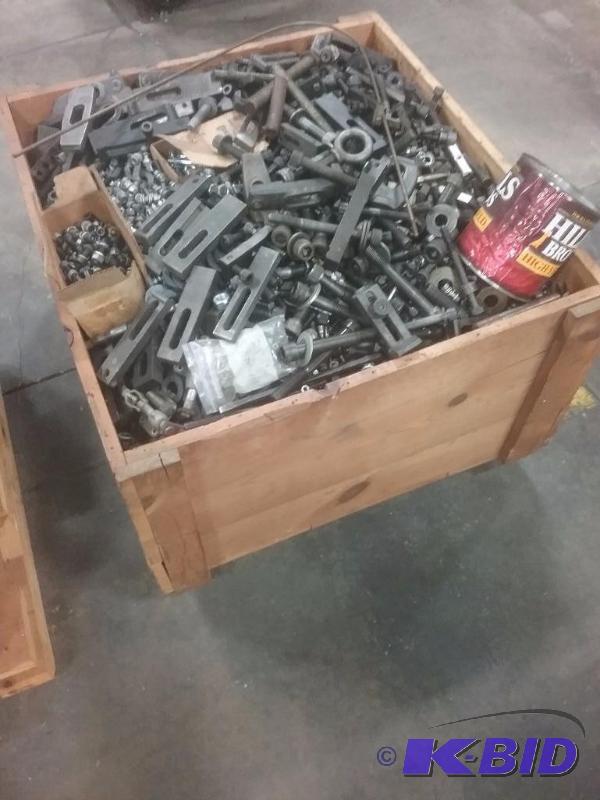 lot 590 image: Wooden crate of larger hold downs and bolts  ...