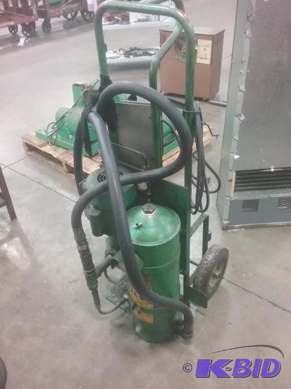 lot 607 image: Sump suction pump with filter on 2-wheel cart...