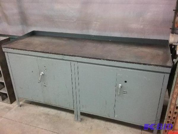 lot 7 image: (2) 2-door cabinets with hard surface top. 24...