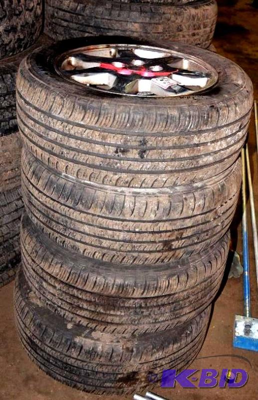 lot 13 image: 4 23550R17 Tires of a Cadillac STS. Bidders...