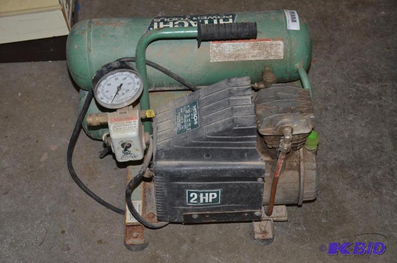lot 24 image: Hitachi 2 hp air compressor model EC-12...