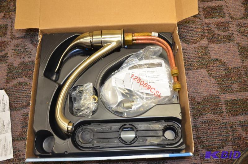 lot 47 image: New in box Moen kitchen faucet model 87480CSL...