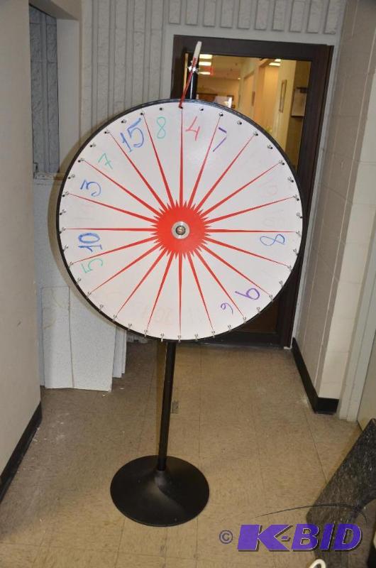 lot 62 image: Spinning game  carnival wheel, 34" diam...