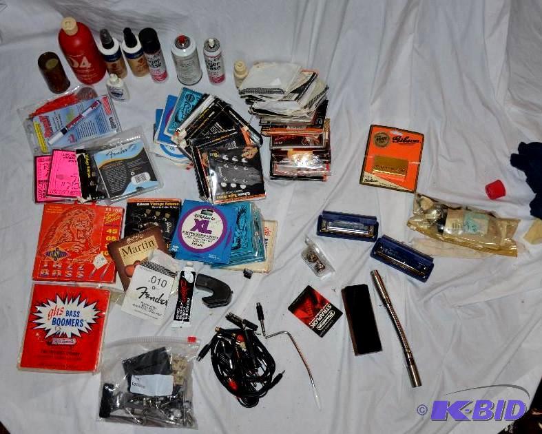 lot 124 image: Guitar strings and musical repair equipment T...