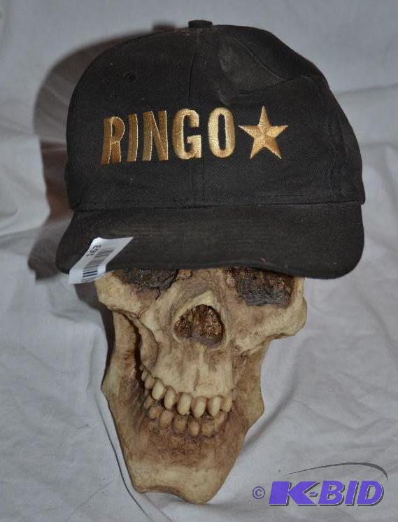 lot 163 image: Life size skull with Ringo Star cap...