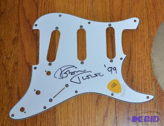 lot 220 image: Robin Trower Autographed guitar guard and pic...