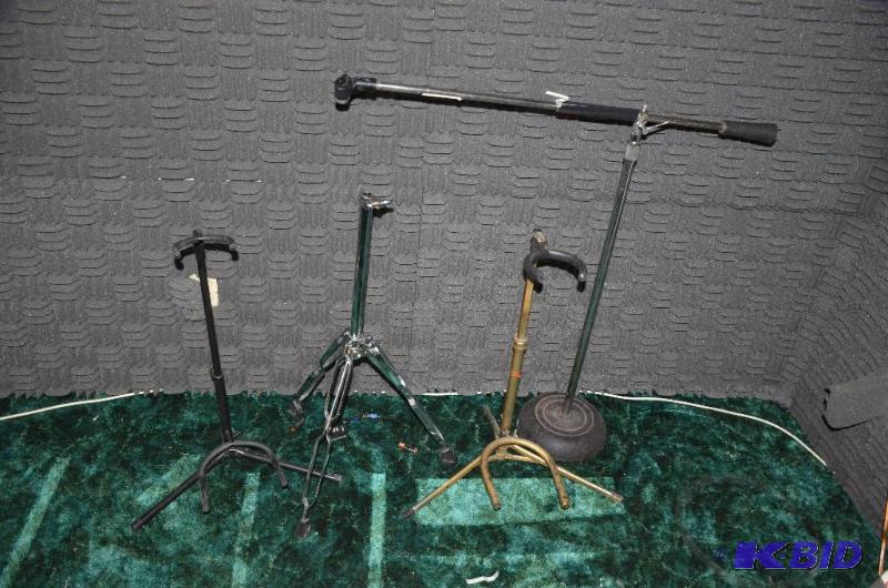 lot 224 image: 2 guitar stands, microphone stand, one more s...