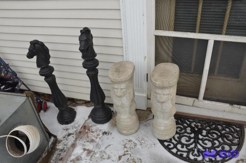 lot 245 image: Two cement statues of lions are 23" tall...