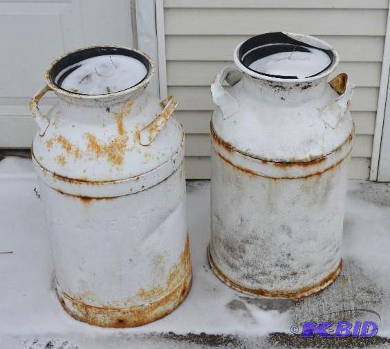 lot 255 image: Two vintage metal milk cans 24" tall...