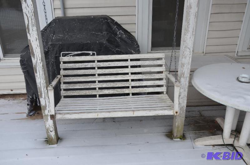 lot 263 image: Wooden deck swing 45" long, hung by chai...