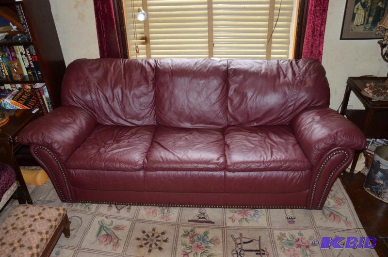 lot 27 image: Red leather Couch 82" long ,bring help t...
