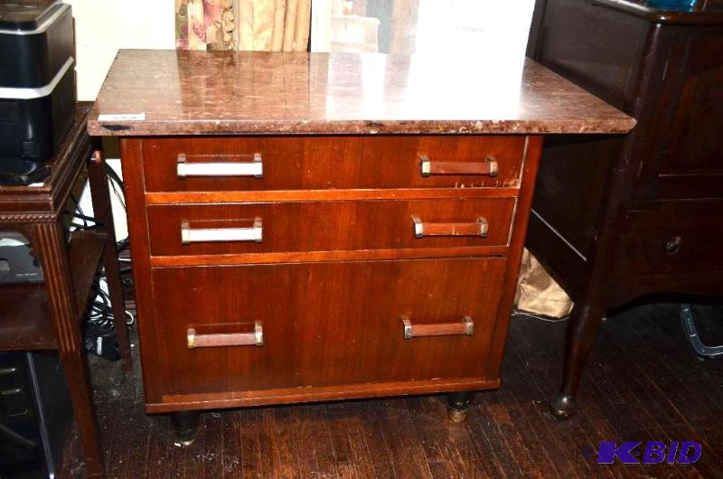 lot 7 image: Wood dresser with a granite stone top. Dress...