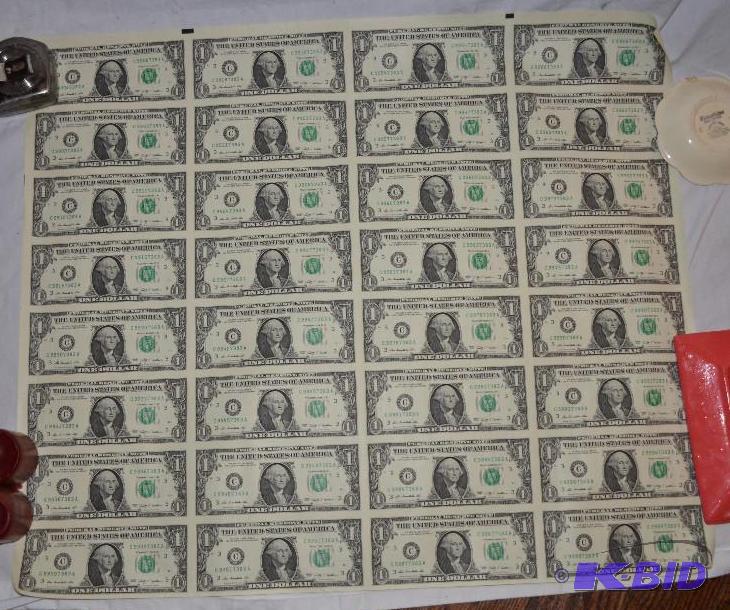 lot 94 image: Sheet of 24 USA $1 bills, un-cut sheet...